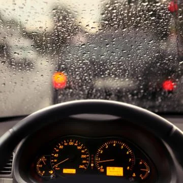 Rain droplets on car windshield Stock Photos