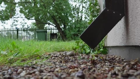 Rain Droplets Draining From a Gutter Stock Footage 260366664