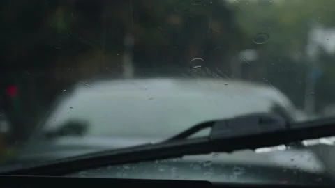 Rain Droplets Falling on Car Windshield During a Stormy Summer Day Stock Footage 341997379