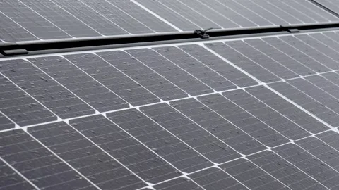 Rain droplets on solar panels on a rainy day Stock Footage 260366732