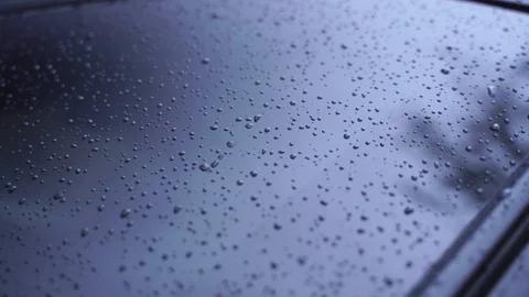 Rain droplets sprinkling on window Stock Footage 123911593