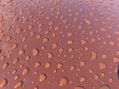 Rain droplets texture on painted metal surface Stock Photos