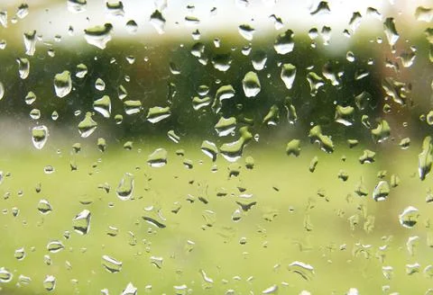 Rain droplets on a window pane, looking out Stock Photos