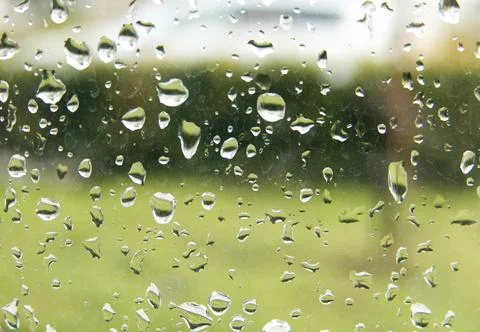 Rain droplets on a window pane, looking out Stock Photos