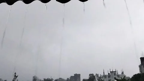 Rain Dropping on Blue Lake. Rainy Season in Tropical Countries. Stock Footage 287779536