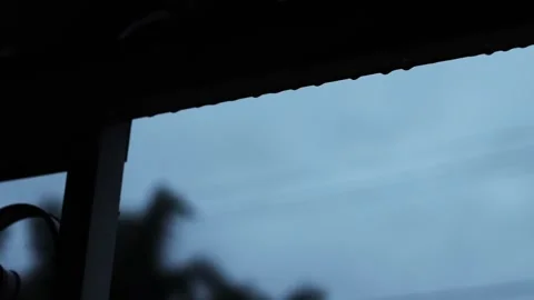 Rain dropping from patio, dark and gloomy weather, 4K, cinematic Stock Footage 250679110