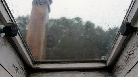 Rain dropping on the window in the afternoon Stock Footage 105820484