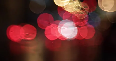 Rain drops 4k falling on a window with bokeh light effects Stock Footage 134214996