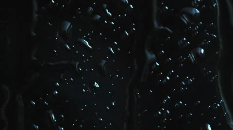 Rain drops appearing on a window glass, rain starting, drops texture Stock Footage 35252575