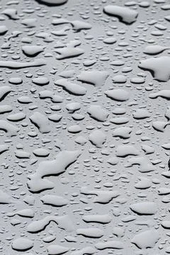 Rain drops Background texture accumulate on a glass surface, transforming it Stock Photos