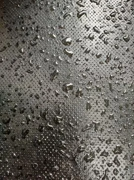 Rain drops on the black texture. 写真素材