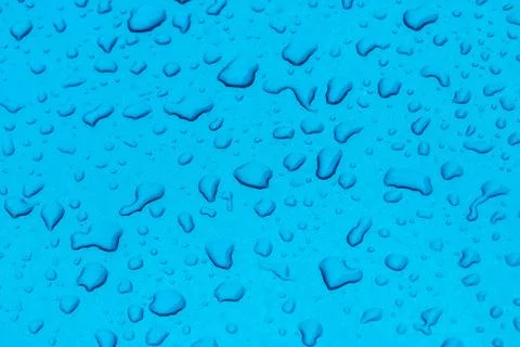 Rain drops on the blue floor Stock Photos