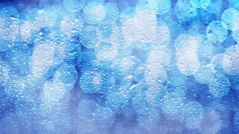 Rain drops on blurry blue bokeh background Vídeos de archivo 122405079