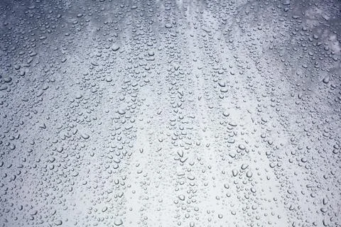 Rain drops on a car high Stock Photos