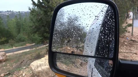 Rain drops on car mirror Stock Footage 12622889
