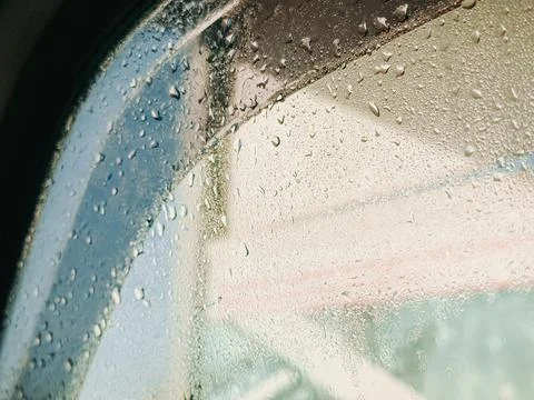 Rain Drops on Car Window Close-Up with Blurred Background Stock Photos