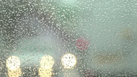 Rain drops on the car window glass Stock Footage 163860955