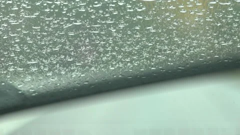 Rain drops on the car window glass Stock Footage 163860964