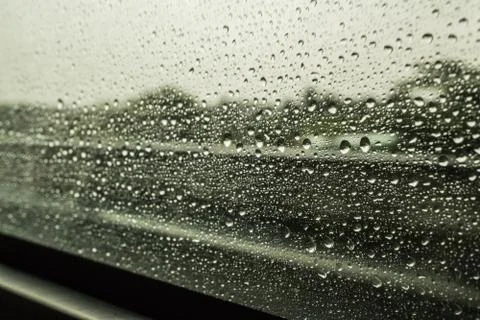 Rain drops on a car window Stock Photos