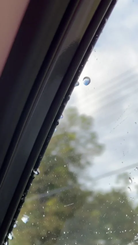 Rain drops on car window when car moving Stock Footage 262416332