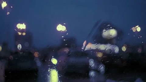 Rain Drops on the car windshield  and colourful traffic bokeh light. Video stock 147560066