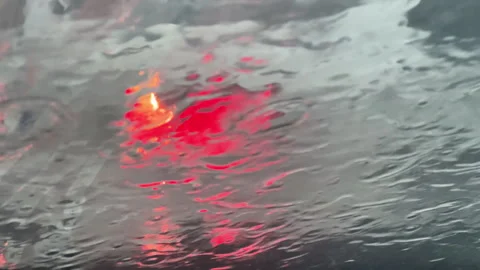 Rain Drops On Car Windshield With Blurred City Traffic Lights Stock Footage 340904321