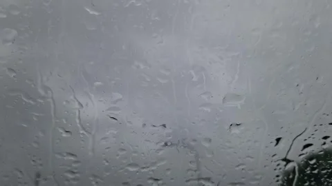 Rain drops on a car windshield Stock Footage 275275838