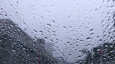Rain drops on a car windshield glass Stock Footage 145571083