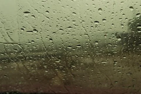 Rain drops on car windshield Stock Photos