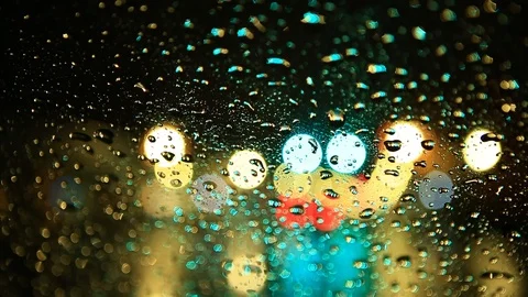 Rain Drops on Car Windshield with Traffic and City Lights Bokeh Blur Stock Footage 100514519