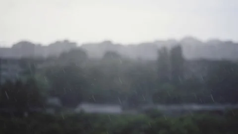 Rain drops close up with city buildings behind in blur Stock Footage 75575283