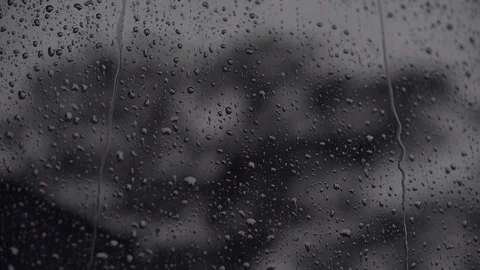 Rain drops on a dark glass Stock Footage 129747437