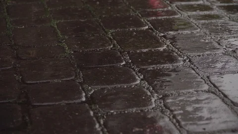 Rain drops on a dark paved surface, close-up Vídeo Stock 121376112