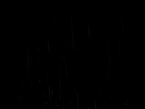 Rain drops that fall chaotically during a torrential rain seen in the light o Stock Footage