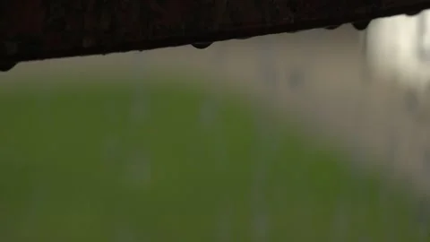 Rain drops fall from the roof Stock Footage 141365755