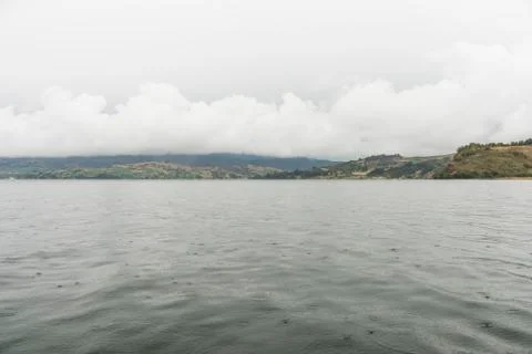 Rain drops fall on the surface of the water in the largest lake in Colombia Stock Photos