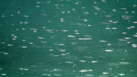 Rain drops fall in water 01 – 120fps slow motion Stock Footage 80360819