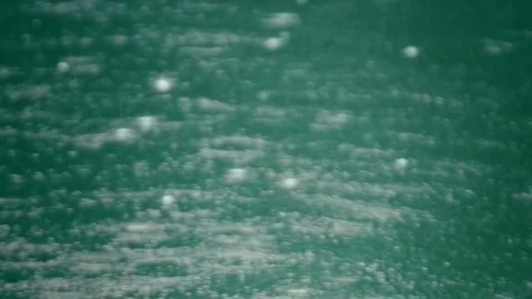 Rain drops fall in water 03 – 120fps slow motion Stock Footage 80367558