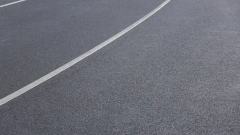 Rain drops falling on asphalt. Video stock 98295274