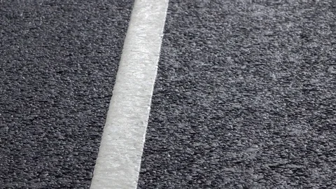 Rain drops falling on asphalt. Stock Footage 98407430