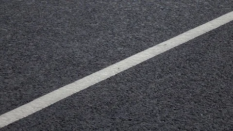 Rain drops falling on asphalt. Vídeo Stock 98427676