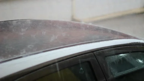 Rain drops falling on the car. Heavy rain and water splash Stock Footage 133506338