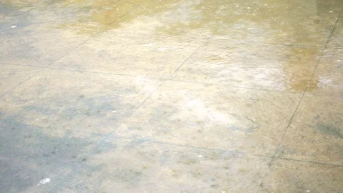 Rain drops falling on concrete floor Stock Footage 115697859