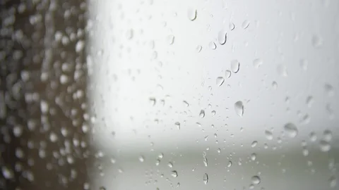 Rain drops falling down on glass Stock Footage 108775872