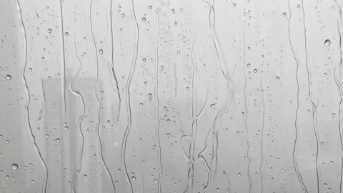 Rain Drops Falling down on Window, HD quality footage of Rain on Window Sky D Stock Footage 171329365
