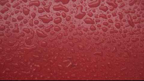 Rain drops falling on red surface vertical gradient Stock-Footage 2269751