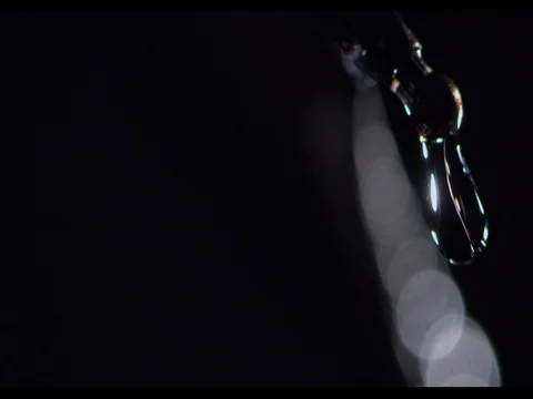 Rain drops falling from the rib of black umbrella, right side of the shot Stock Footage 74216658