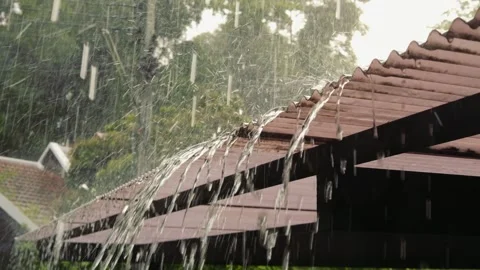 Rain Drops Falling on Roof, Water Dripping in a Tropical Storm, Rain season in Stock Footage 311249951