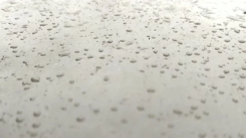 Rain drops falling on shiny surface of glass Stock Footage 137223398