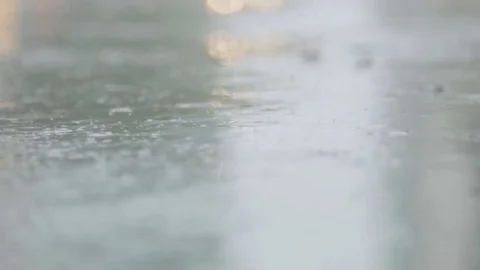 Rain drops falling on the street Stock Footage 76545027